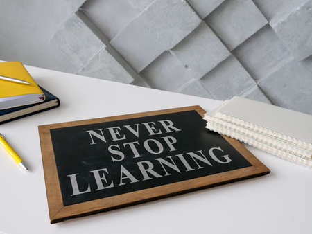 Never stop learning on the blackboard about lifelong education.の写真素材
