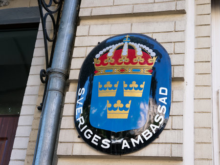 KYIV, UKRAINE - July 07, 2021. Sveriges ambassad. Coat of arms on the wall of the Swedish embassy.のeditorial素材