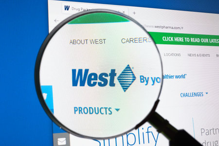 KYIV, UKRAINE - June 30, 2021. Website of West westpharma pharmaceutical company and magnifier.のeditorial素材