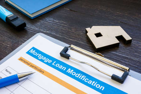 Mortgage loan modification application with pen and notepad.の写真素材