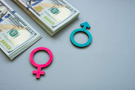 Money and symbols as gender inequality or pay gap.の写真素材