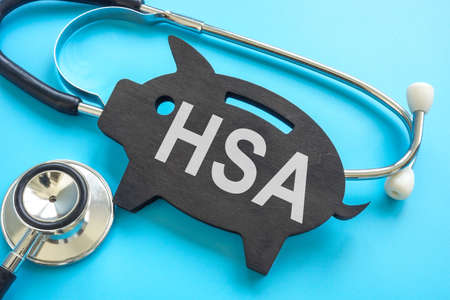 HSA health savings account. Stethoscope and piggy bank.の写真素材