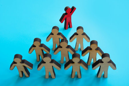 Leadership concept. Leader and figures of employees.