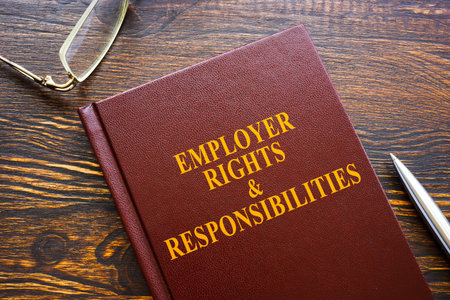 Employer Rights and Responsibilities book and glasses.