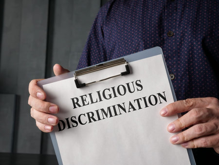 Papers about religious discrimination in the lawyer hands.