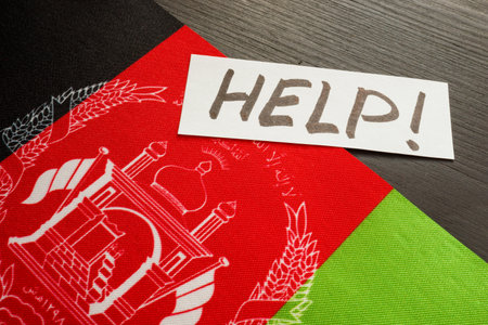 Afghanistan flag and sticker with word help.の写真素材