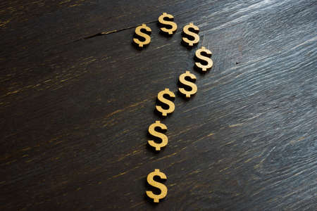 Business uncertainty in trading. A question mark made from dollar signs.の写真素材