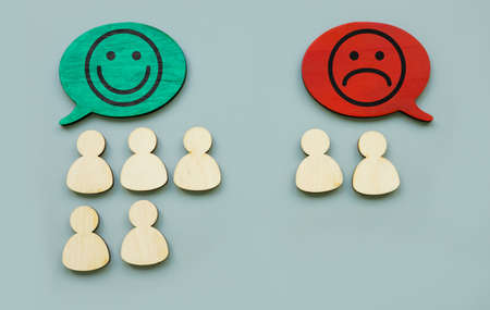 Happy and unhappy faces and figures. Customer satisfaction concept.の写真素材