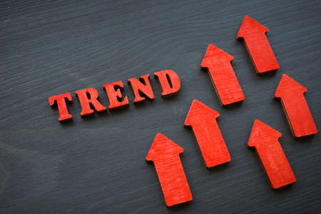 Modern trend word and red rising arrows.の写真素材