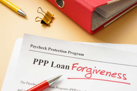 PPP loan forgiveness handwritten word on the application.の写真素材
