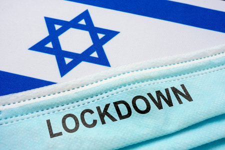 Israel flag with face mask and lockdown lettering.