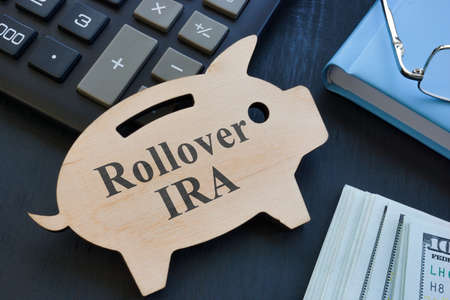 Piggy bank and words rollover IRA on it.の写真素材