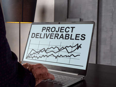 Project deliverables with charts on the laptop screen.の写真素材