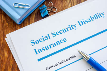 Social Security Disability Insurance SSDI application form and pen.の写真素材