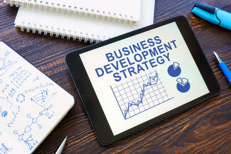 Business development strategy with charts in the tablet.の写真素材