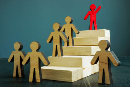 Leadership and career success concept. Ladder and winner at the top.の写真素材