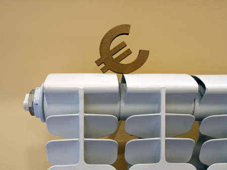 The euro sign on radiator as a symbol of the cost of heating.の写真素材