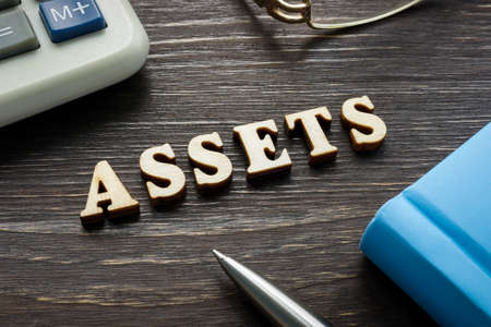 Word assets from wooden letters on the desk.の写真素材