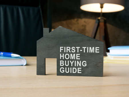 Dark model of home with sign first-time home buying guide.の写真素材