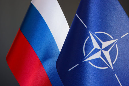 KYIV, UKRAINE - October 6, 2021. Flags NATO and Russia.
