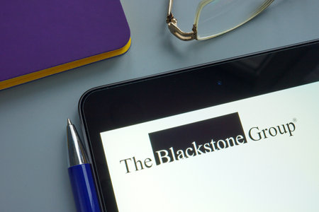 KYIV, UKRAINE - December 03, 2021. Tablet with the blackstone group logo.のeditorial素材