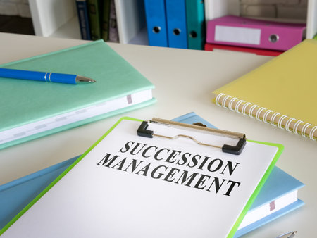 Succession management plan with clipboard and papers.