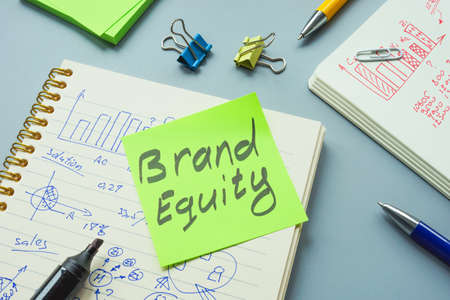 Brand equity mark and open notepad with calculations.の写真素材