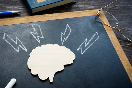 Model of brain and arrows as stroke or emotional pressure.の写真素材