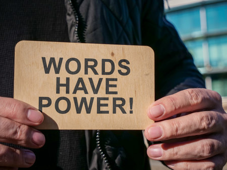 Man holds plate with sign Words have power.の写真素材