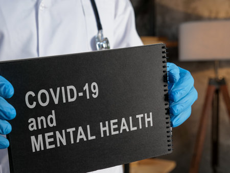 Doctor shows about Covid 19 and mental health info.の写真素材