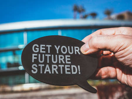 Get your future started. Man holds bubble quote.の写真素材