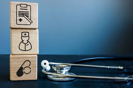 Health insurance or medicare concept. Stethoscope and cubes.の写真素材