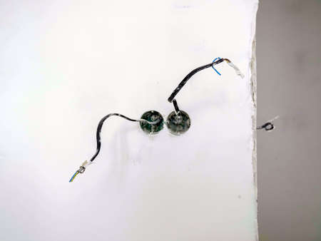 Apartment renovation concept. New wiring for socket and switch in the wall.の写真素材