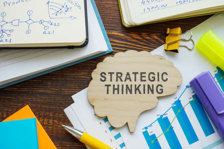 Strategic thinking words on the brain shape and papers.の写真素材