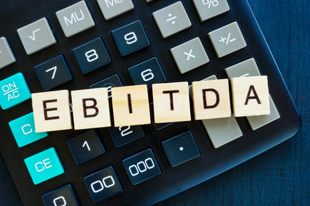 EBITDA Earnings Before Interest, Taxes, Depreciation, and Amortization concept. Letters on the...