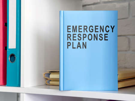 Blue book emergency response plan on the shelf.の写真素材