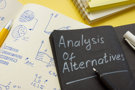Open notepad with analysis of alternatives and marks.