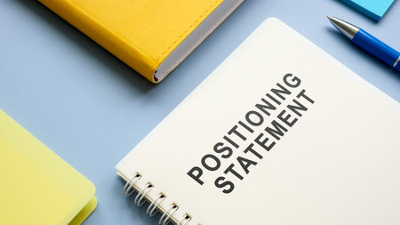 Positioning statement and notepads on the table.