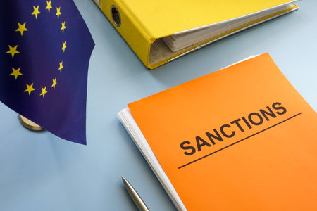 EU flag and sanctions list with a folder.の写真素材
