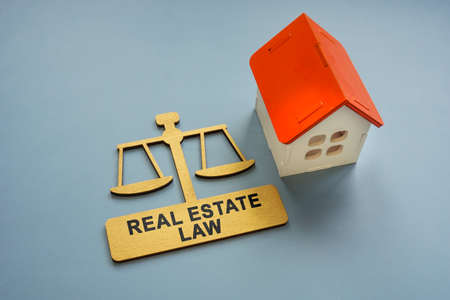 Model of the house and a sign real estate law.の写真素材