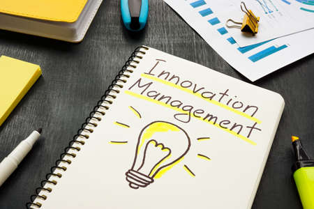 Innovation management words on the page and marker.の写真素材