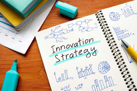 Innovation strategy in the open notebook with charts.の写真素材