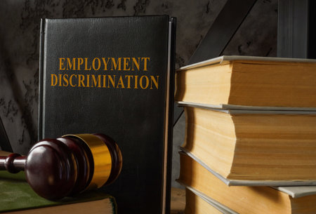 Book with law about Employment discrimination and gavel.の写真素材
