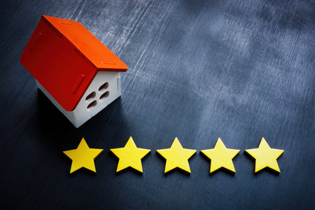 Model of home and five stars. Real estate appraisal concept.の写真素材
