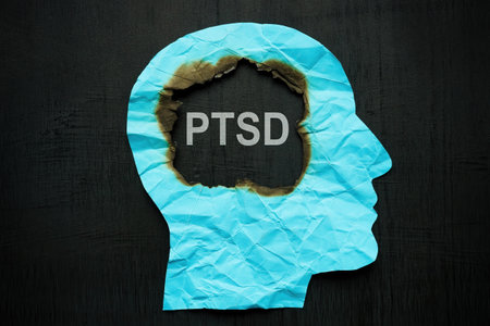A paper head burned inside and an inscription PTSD.の写真素材