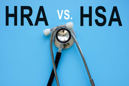 Words HRA vs HSA and stethoscope on the blue surface.