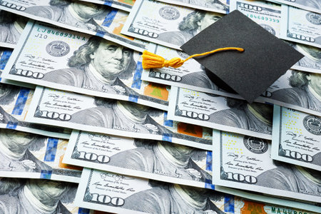 Graduation cap on the stack of money. Student loan concept.の写真素材