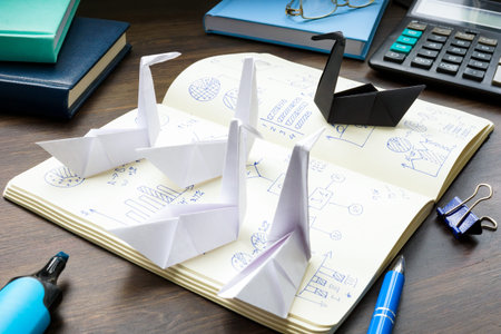 Black paper swan as a symbol of the unexpected in forecasting theory.の写真素材