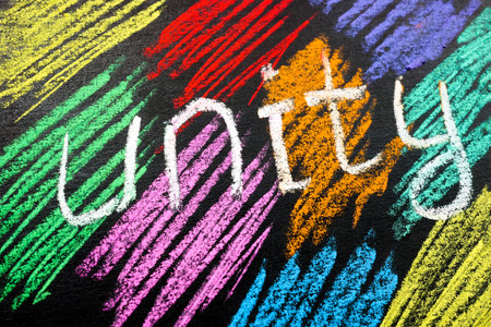 Colored stripes drawn with crayons and an inscription Unity.の写真素材