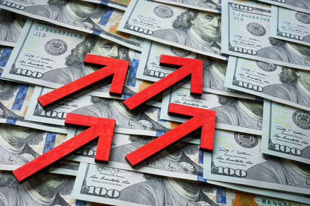 Growing income and savings rising arrows on cash.